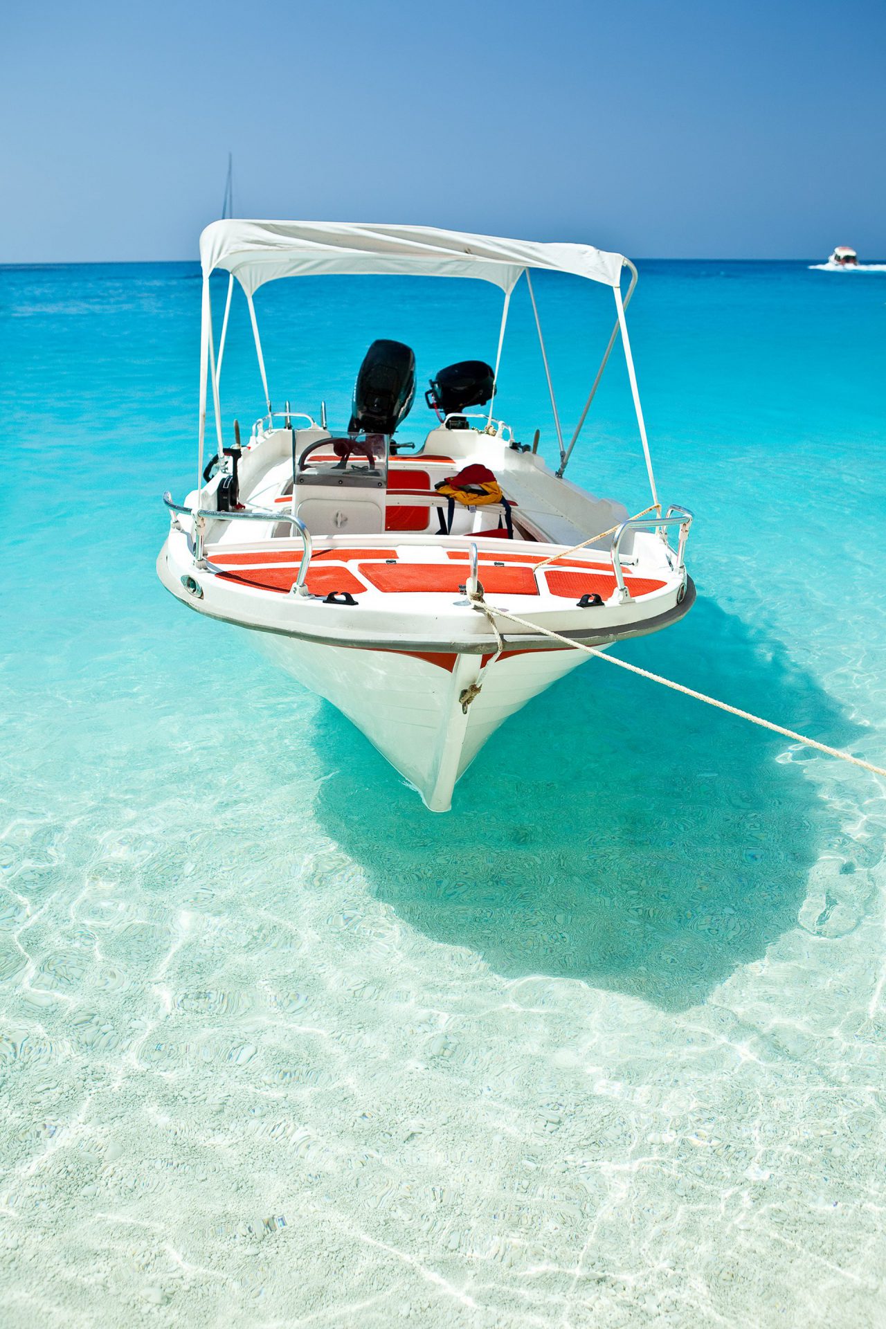 boat anchored on a snadbar